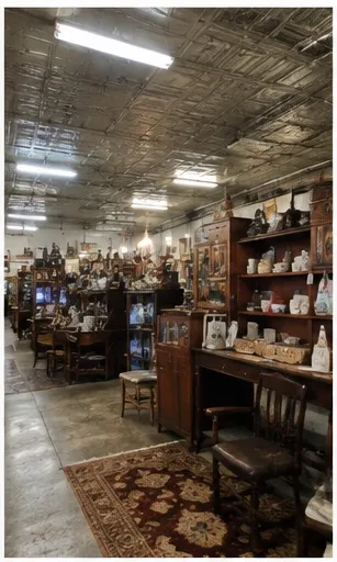 Wide view of the market floor beneath a pressed-tin ceiling